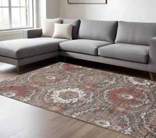 7' X 9' Rust Floral Stain Resistant Area Rug