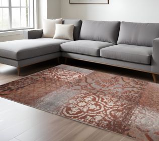 7' X 9' Rust And Gray Damask Distressed Stain Resistant Area Rug