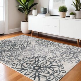 4' X 6' Oatmeal And Gray Medallion Power Loom Stain Resistant Area Rug