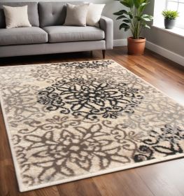 5' X 8' Tan Gray And Black Floral Medallion Stain Resistant Area Rug