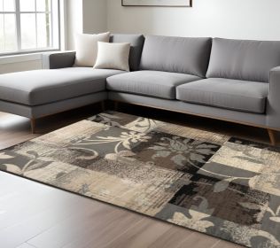7' X 9' Beige And Gray Floral Power Loom Distressed Stain Resistant Area Rug