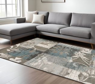 7' X 9' Teal Gray And Tan Floral Power Loom Distressed Stain Resistant Area Rug