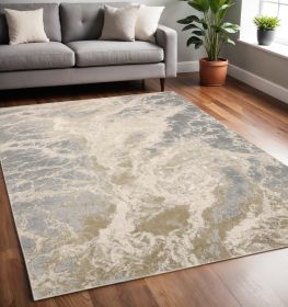 5' X 8' Ivory Silver And Gold Abstract Stain Resistant Area Rug