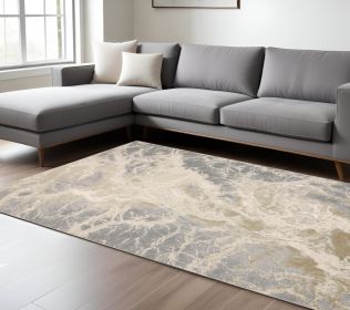 7' X 10' Ivory Silver And Gold Abstract Stain Resistant Area Rug