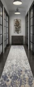 12' Tan Ivory And Blue Abstract Power Loom Distressed Runner Rug